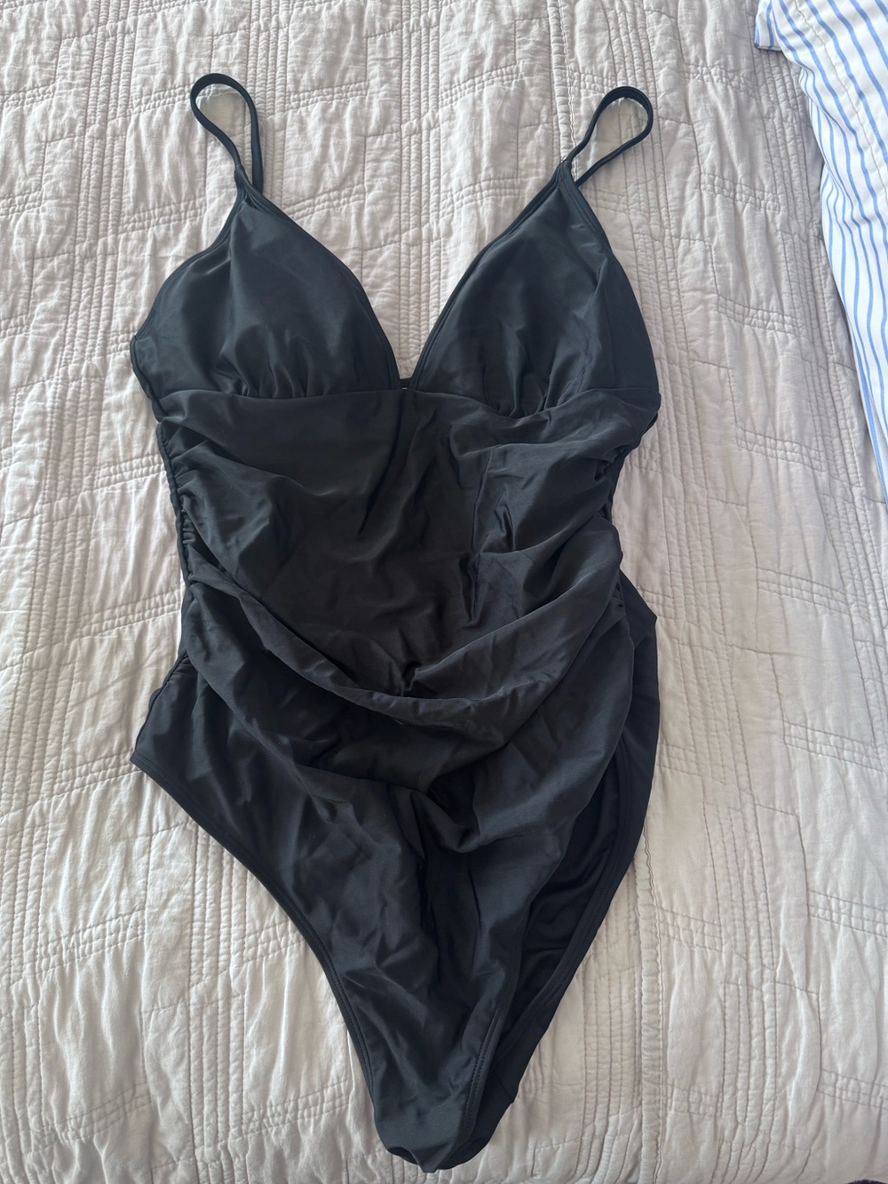 One piece swimsuit with ruched sides and tummy control
